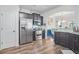 Modern kitchen featuring stainless steel appliances and dark wooden cabinetry at 3143 Bonnes Dr, Stonecrest, GA 30038