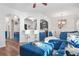 Open-concept living room with blue decor connecting the kitchen and dining area at 3143 Bonnes Dr, Stonecrest, GA 30038