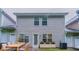A fenced backyard with patio, exterior siding and manicured lawn at 541 Shadow Valley Ct, Lithonia, GA 30058