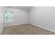 Bedroom features neutral walls, plush carpeting, and lots of natural light at 541 Shadow Valley Ct, Lithonia, GA 30058