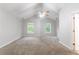 Open bedroom features neutral carpeting, large windows, and lots of natural light at 541 Shadow Valley Ct, Lithonia, GA 30058