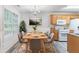 Bright dining room with modern chandelier, natural light, and space for six at 541 Shadow Valley Ct, Lithonia, GA 30058