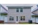 A fenced backyard with patio and grass area at 541 Shadow Valley Ct, Lithonia, GA 30058