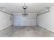 A spacious two car garage with concrete floor and automatic door at 541 Shadow Valley Ct, Lithonia, GA 30058