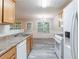 Kitchen featuring modern appliances, granite countertops, and hardwood floors at 541 Shadow Valley Ct, Lithonia, GA 30058