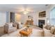 Staged living room showcasing fireplace, cozy furniture, and comfortable decor at 541 Shadow Valley Ct, Lithonia, GA 30058