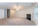 Large living room offering fireplace and staircase access at 541 Shadow Valley Ct, Lithonia, GA 30058