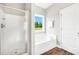 Bathroom featuring a shower, garden tub and white cabinetry at 715 Colvin Dr, Locust Grove, GA 30248