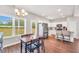 Well-lit dining area connects to a modern kitchen and offers backyard views at 715 Colvin Dr, Locust Grove, GA 30248