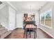 Cozy dining room with a dark dresser and a black dining table and chairs at 715 Colvin Dr, Locust Grove, GA 30248