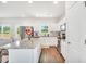 Bright kitchen features stainless steel appliances, granite countertops and a center island at 715 Colvin Dr, Locust Grove, GA 30248