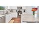 Well-equipped kitchen features white cabinets, stainless steel appliances and granite countertops at 715 Colvin Dr, Locust Grove, GA 30248