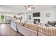 Open concept living room flowing into a modern kitchen with stainless steel appliances at 715 Colvin Dr, Locust Grove, GA 30248