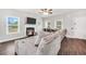 Comfortable living room with fireplace, tv, ceiling fan, and plush sectional sofa at 715 Colvin Dr, Locust Grove, GA 30248