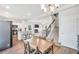 A living space featuring a seamless flow between kitchen, dining and living room with fireplace at 715 Colvin Dr, Locust Grove, GA 30248