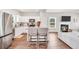 An open-concept living space offers seamless flow between kitchen and living room, plus a fireplace at 715 Colvin Dr, Locust Grove, GA 30248