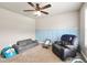Comfortable room with gray sofas, blue board and batten accent wall at 715 Colvin Dr, Locust Grove, GA 30248