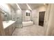 Bright bathroom features double vanity, large shower, and soaking tub at 255 Carriage Station Dr, Lawrenceville, GA 30046