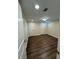 Comfortable bedroom with hardwood floors, ample lighting, and neutral paint, creating a serene atmosphere at 255 Carriage Station Dr, Lawrenceville, GA 30046
