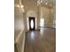 Spacious entryway with hardwood floors, wainscoting, high ceilings, and a view of the formal living area at 255 Carriage Station Dr, Lawrenceville, GA 30046