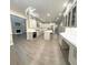 Modern kitchen features white cabinets, stainless steel appliances, a center island, and sleek countertops at 255 Carriage Station Dr, Lawrenceville, GA 30046