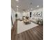 Spacious living room is bright with recessed lighting, wood floors, neutral decor, and a seating area at 255 Carriage Station Dr, Lawrenceville, GA 30046