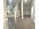 Open-concept living room with gleaming hardwood floors, high ceilings, and lots of natural light at 255 Carriage Station Dr, Lawrenceville, GA 30046