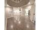 Spacious bedroom with tray ceiling, light walls, and wood flooring at 255 Carriage Station Dr, Lawrenceville, GA 30046