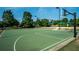 Outdoor basketball court with well-maintained green surface and hoops, perfect for recreational activities at 118 Brendylynn Trce, Woodstock, GA 30188