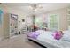 Cozy bedroom with carpet, ceiling fan, and windows with natural light at 118 Brendylynn Trce, Woodstock, GA 30188