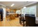A spacious kitchen with stainless steel appliances and a central island features hardwood floors and a window view at 118 Brendylynn Trce, Woodstock, GA 30188
