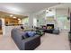 Open concept living room featuring a fireplace, vaulted ceilings, and a view into the kitchen at 118 Brendylynn Trce, Woodstock, GA 30188