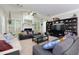 Comfortable living room featuring high ceilings, fireplace, and built-in shelving at 118 Brendylynn Trce, Woodstock, GA 30188
