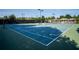 Well-maintained tennis courts surrounded by trees in a private community at 118 Brendylynn Trce, Woodstock, GA 30188