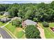 Aerial view of a brick home with lush landscaping, and expansive backyard at 208 Regency Ct, Acworth, GA 30102