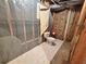 Unfinished basement bathroom with toilet and some coverings, ready for renovation and personalization at 208 Regency Ct, Acworth, GA 30102
