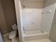 Clean bathroom with a combined tub and shower featuring white tile and neutral walls at 208 Regency Ct, Acworth, GA 30102
