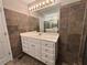Vanity with a single sink, decorative tile wall, and tile flooring at 208 Regency Ct, Acworth, GA 30102