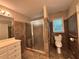 Bathroom with tile flooring, walk-in shower, and convenient toilet placement at 208 Regency Ct, Acworth, GA 30102