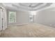 Spacious bedroom with tray ceiling and natural light at 208 Regency Ct, Acworth, GA 30102