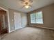 Bedroom with a ceiling fan, closet, and two windows that offer natural light at 208 Regency Ct, Acworth, GA 30102