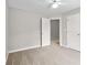 Bedroom with neutral walls, ceiling fan, and ensuite bathroom access at 208 Regency Ct, Acworth, GA 30102