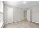 Bedroom featuring a large window, neutral walls, and ensuite bathroom access at 208 Regency Ct, Acworth, GA 30102