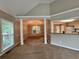 Dining room with elegant pillars, stylish lighting, and serene outdoor views at 208 Regency Ct, Acworth, GA 30102