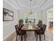 Dining room showcasing table set for eight with view of the front yard at 208 Regency Ct, Acworth, GA 30102