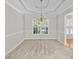 Formal dining room with tray ceiling and elegant chandelier at 208 Regency Ct, Acworth, GA 30102