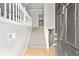 Light and airy foyer with hardwood floors and staircase at 208 Regency Ct, Acworth, GA 30102
