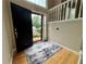 Foyer with hardwood floors, high ceilings, and open entry at 208 Regency Ct, Acworth, GA 30102