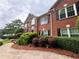 Inviting red brick home with well-maintained landscaping and a welcoming walkway at 208 Regency Ct, Acworth, GA 30102