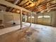 Unfinished garage with multiple bays, exposed ceiling beams, and ample space for vehicles and storage at 208 Regency Ct, Acworth, GA 30102